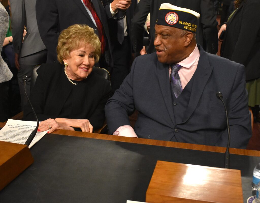 Paul Mimms visits with former Senator, former Secretary of Labor, and former President of the American Red Cross Elizabeth Dole prior to Wednesday Congressional Hearing. Seated next to Paul at the witness table, Senator Dole offered opening remarks at the hearing in support of caregiver legislation.