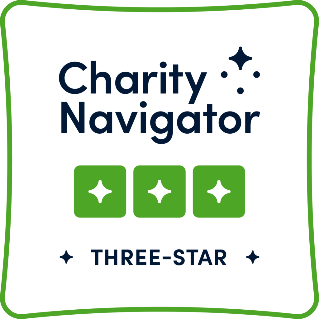Charity navigator logo with has the words "Charity Navigator" stack at the top with stars in the space after "Charity." Below that are three green boxes with a white star in the center of each. At the bottom is text that reads "Three-Star." The whole image is outlined in a green square.