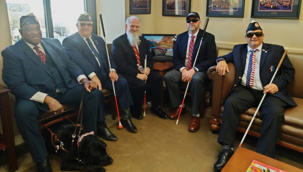 March 21 photo of BVA Executive Committee and Judge Advocate Stephen Butler in Washington office of Senator Jerry Moran. Left to right, National President Paul Mimms with guide dog Shadow, Vice President Wade Davis, Stephen Butler, National Treasurer Joe Bogart, and National Secretary Tracy Ferro.