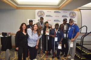 BVA members pose with OrCam representatives at the BVA Step and Repeat