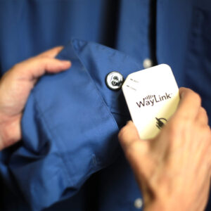 A person scanning a blue shirt with the WayLink